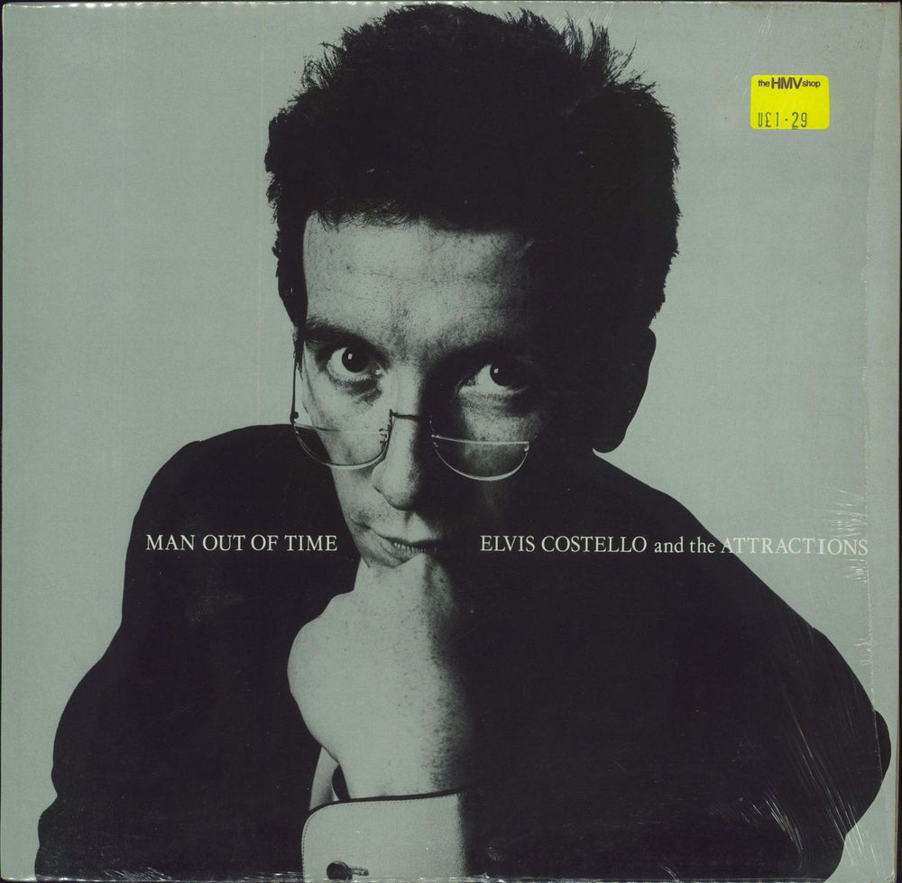 Elvis Costello Man Out Of Time - Open Shrink UK 12" vinyl single (12 inch record / Maxi-single) XX28T