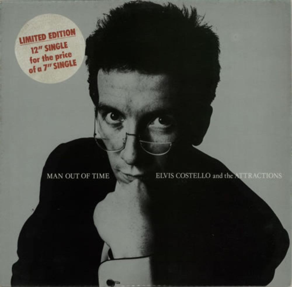 Elvis Costello Man Out Of Time - Stickered Sleeve UK 12" vinyl single (12 inch record / Maxi-single) XX28T