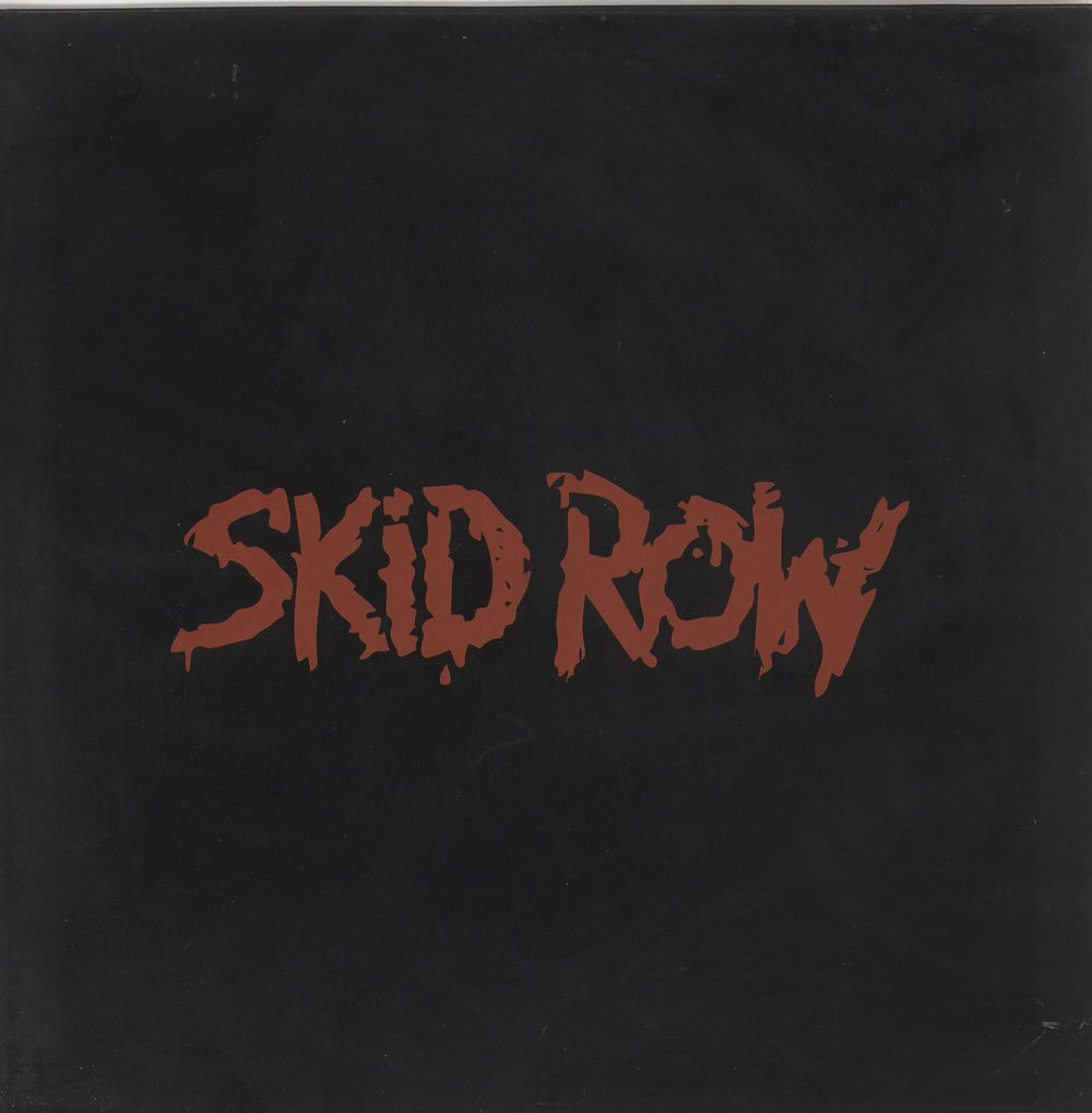 Skid Row (80s) Slave To The Grind - Rubber Sleeve UK 12" vinyl single (12 inch record / Maxi-single) A7603TX