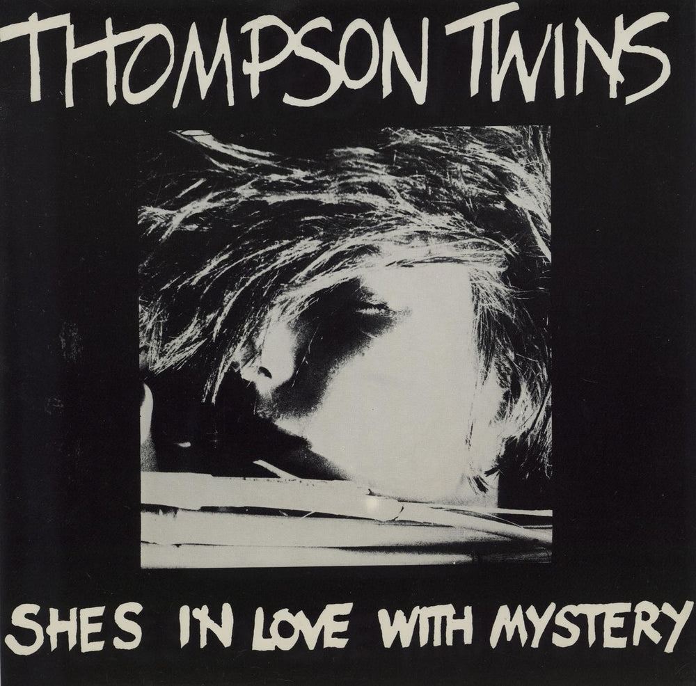 Thompson Twins She's In Love With Mystery UK 7" vinyl single (7 inch record / 45) LATE1